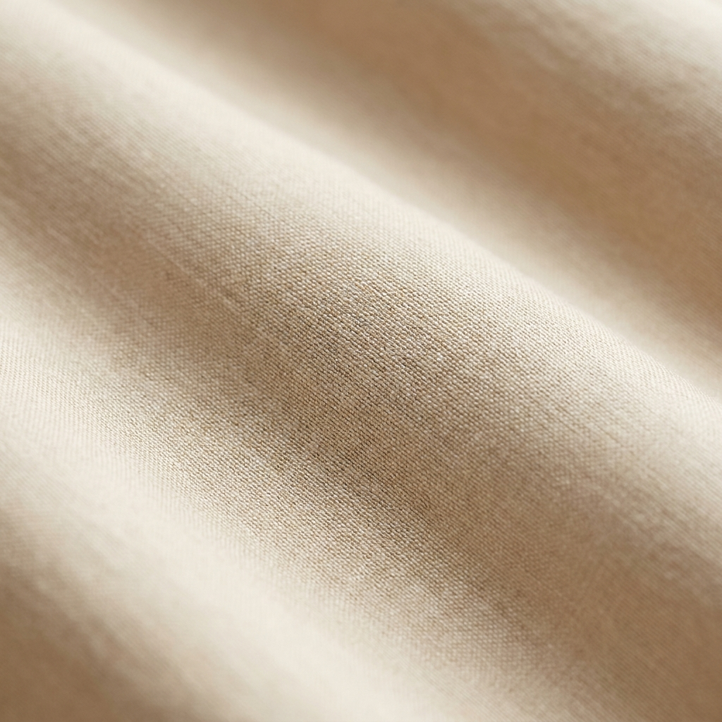 Gros plan macro sur le coton égyptien longues fibres Noctua Paris, tissage serré