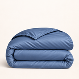 Housse de couette en Lyocell bleu, pliage généreux sur fond ivoire