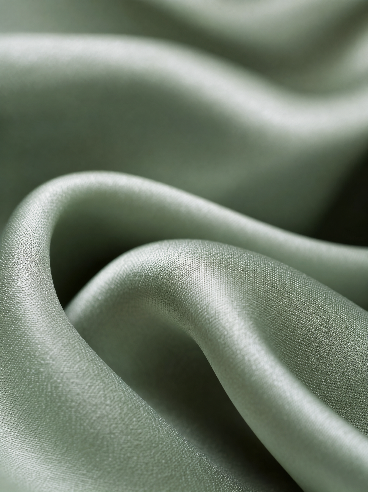 Gros plan macro sur le satin de Lyocell d'eucalyptus vert sauge Noctua Paris