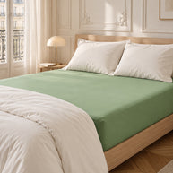 noctua_drap-housse-coton-egyptien_vert-feuille_01-lit-fait_paris